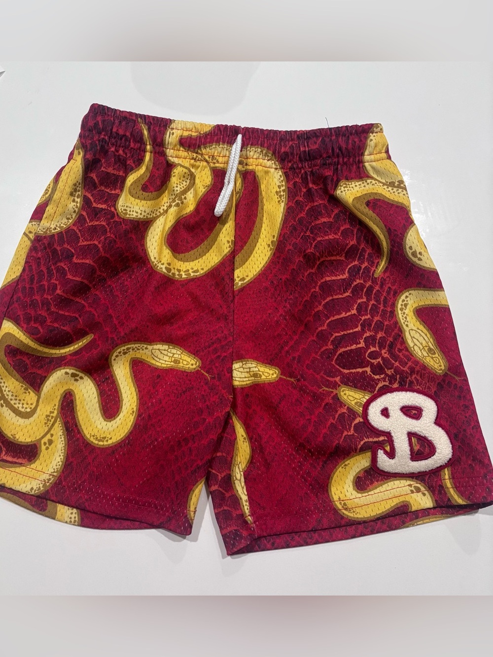 BUCKETSQUAD Snake Print Shorts